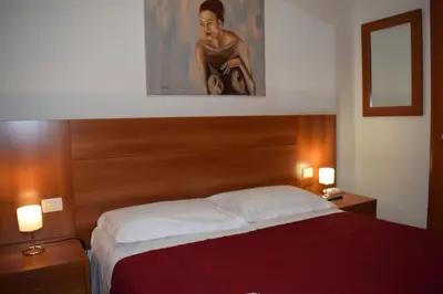 Letto o letti in una camera di Hotel Dalmazia