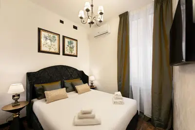 Letto o letti in una camera di Pitti Elegant Suite