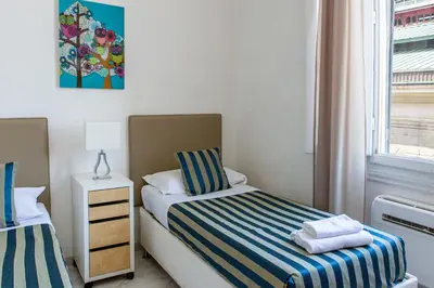 Letto o letti in una camera di San Lorenzo Market - 2 Bedroom Apartment