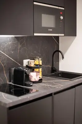 Cucina o angolo cottura di Cavour FillYourHomeWithLove Design Apartment