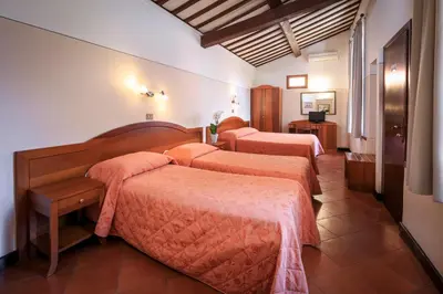 Letto o letti in una camera di Hotel Arno Bellariva