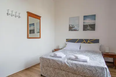 Letto o letti in una camera di Paraiso
