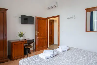 Letto o letti in una camera di Paraiso