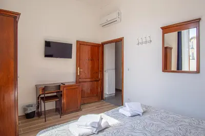 Letto o letti in una camera di Paraiso