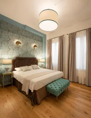 Letto o letti in una camera di Via dei Pepi 3 - Florence Charming Apartments - Chic retreat Apartment a few steps from Santa Croce Square