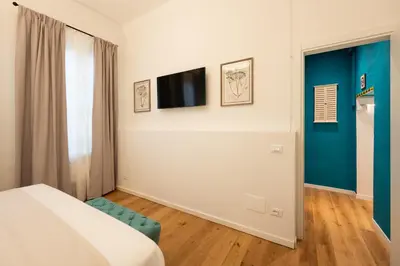 Letto o letti in una camera di Via dei Pepi 3 - Florence Charming Apartments - Chic retreat Apartment a few steps from Santa Croce Square