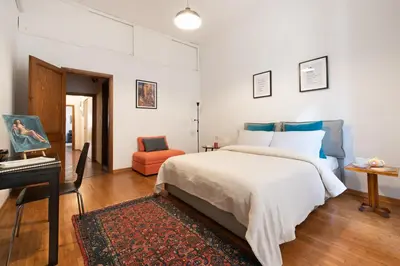 Letto o letti in una camera di Spacious family flat S. Spirito 8 sleeps