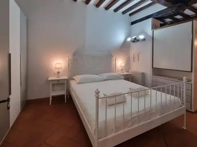 Letto o letti in una camera di Borgo Allegri Apartment