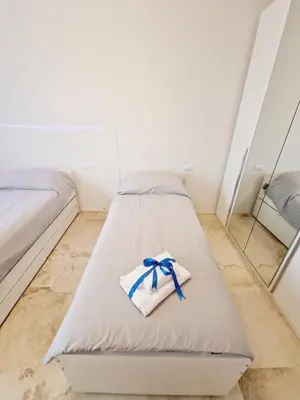 Letto o letti in una camera di Casa Fiorenza