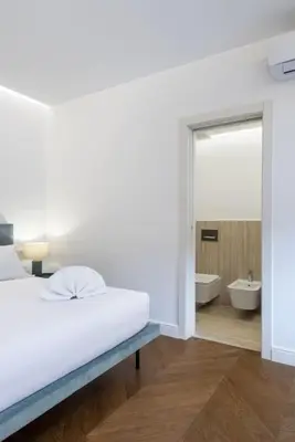 Letto o letti in una camera di UNYCA - Duomo Luxury View Florence