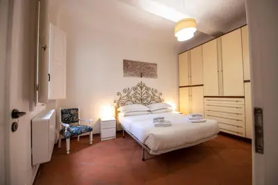 Letto o letti in una camera di Macci Studio by Mamo Florence