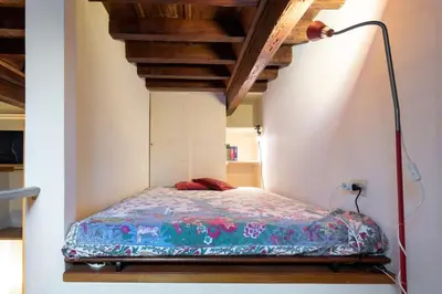 Letto o letti in una camera di Proconsolo Donatello Apartment by Mamo Florence