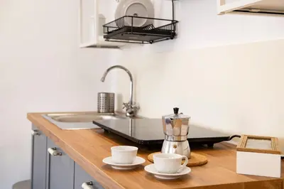 Cucina o angolo cottura di Borgo Santa Croce Apartment by Mamo Florence