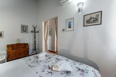 Letto o letti in una camera di GuestHost - Arno River Quiet Apartment