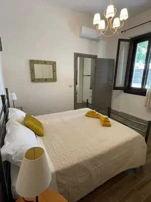 Letto o letti in una camera di Le case di Cate e Max - Sole