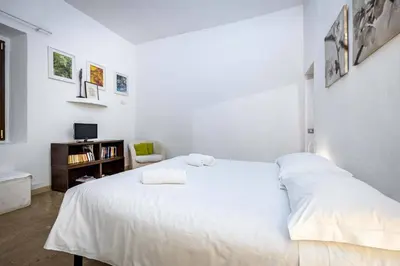 Letto o letti in una camera di Roommo San Iacopino