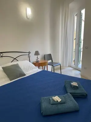 Letto o letti in una camera di Le case di Cate e Max - Luna