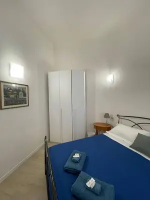 Letto o letti in una camera di Le case di Cate e Max - Luna