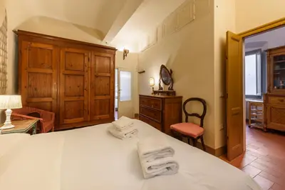 Letto o letti in una camera di Casa torre via de' Nerì by Mmega