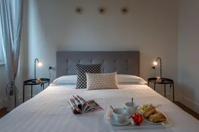 Letto o letti in una camera di Style In Florence - Belcanto Villas