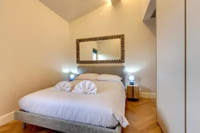 Letto o letti in una camera di Aleardi Roof Apartment by Mamo Florence