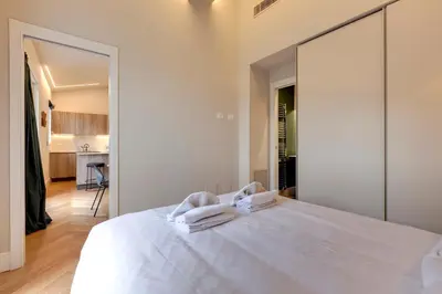 Letto o letti in una camera di Aleardi Roof Apartment by Mamo Florence