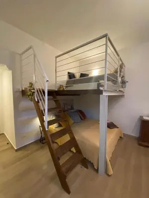 Letto o letti a castello in una camera di Appartamento “Le Tre Sorelle “