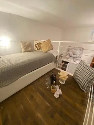 Letto o letti in una camera di Appartamento “Le Tre Sorelle “