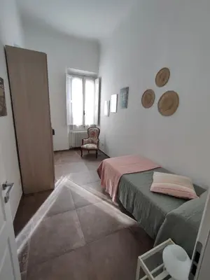 Letto o letti in una camera di La tua casa a Firenze!