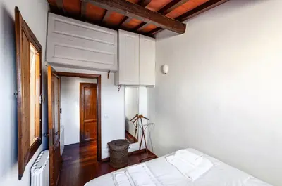 Letto o letti in una camera di GuestHost - The Florentine Rooftop - Santo Spirito Experience