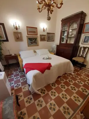 Letto o letti in una camera di Antiques lover's flat, Florence