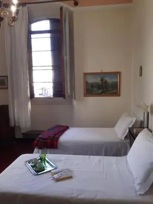 Letto o letti in una camera di Antiques lover's flat, Florence
