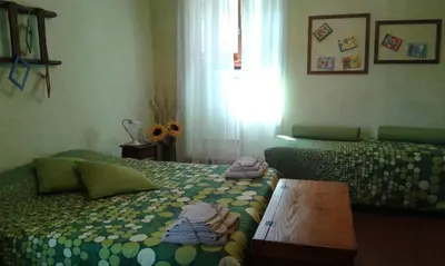 Letto o letti in una camera di La Casetta di Barbara