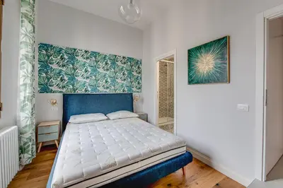 Letto o letti in una camera di Appartamento luminoso zona stazione - Guido Monaco 28