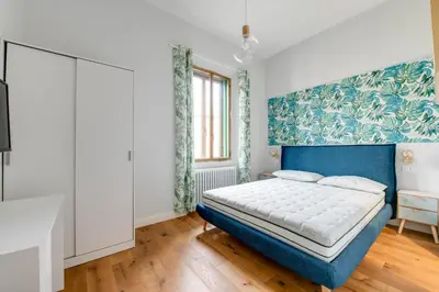 Letto o letti in una camera di Appartamento luminoso zona stazione - Guido Monaco 28