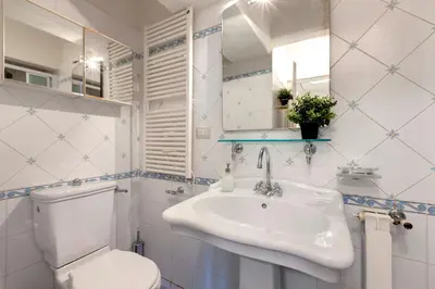 Bagno di Del Guanto Apartment by Mamo Florence