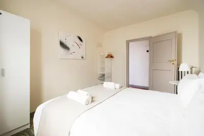 Letto o letti in una camera di [Piazza Pitti]Luminoso Appartamento con Terrazzo e Parcheggio su richiesta