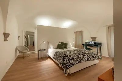 Letto o letti in una camera di Canto Rivolto - Flo Apartments