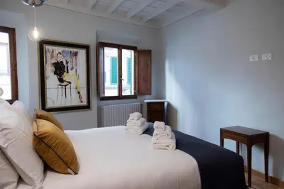 Letto o letti in una camera di Incantevole appartamento in Oltrarno
