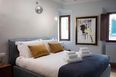 Letto o letti in una camera di Incantevole appartamento in Oltrarno