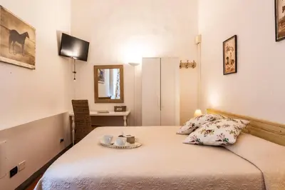 Letto o letti in una camera di B&B San Remigio