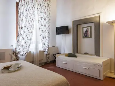Letto o letti in una camera di B&B San Remigio