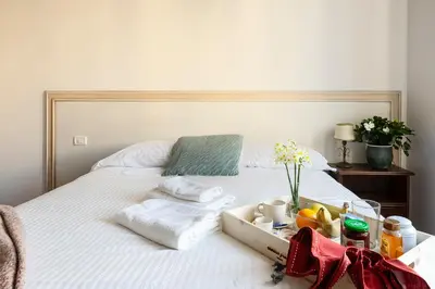 Letto o letti in una camera di San Giovanni Apartment