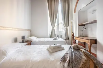 Letto o letti in una camera di San Giovanni Apartment
