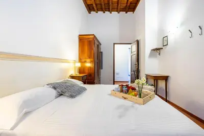 Letto o letti in una camera di San Giovanni Apartment