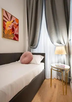 Letto o letti in una camera di Via Palazzuolo 87 - Florence Charming Apartments - Newly Renovated Elegance and Style Near Station