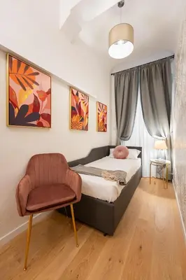 Letto o letti in una camera di Via Palazzuolo 87 - Florence Charming Apartments - Newly Renovated Elegance and Style Near Station
