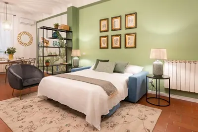 Letto o letti in una camera di Via Palazzuolo 87 - Florence Charming Apartments - Newly Renovated Elegance and Style Near Station