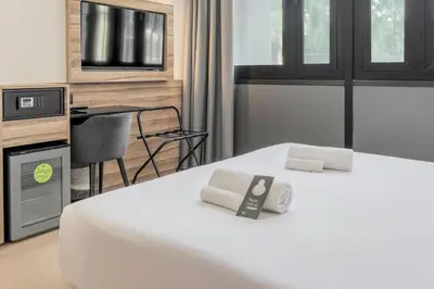 Letto o letti in una camera di B&B HOTEL Prato City Center