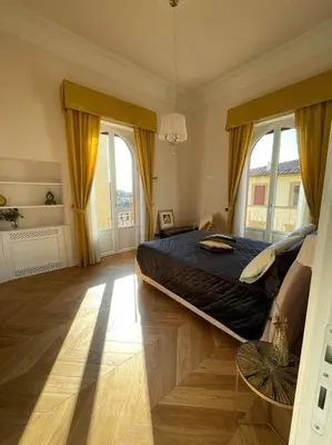 Letto o letti in una camera di Caterina de' Medici luxury attic with terrace and parking